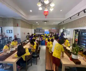 Laughing kids enjoying a creative moment during an art workshop