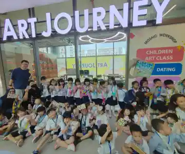 Smiling school children enjoying a fun art jamming session at Art Journey studio
