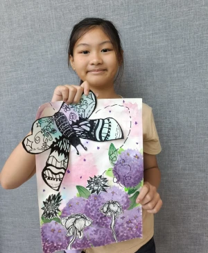 Child exploring milk art technique during kids drawing class in Singapore