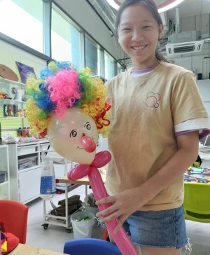 Children creating colorful circus-themed artwork