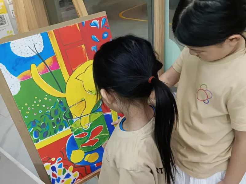 Children celebrating their success at art competition and exhibition