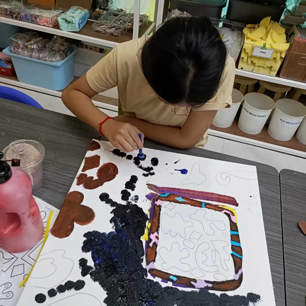 Children drawing enthusiastically during art contest