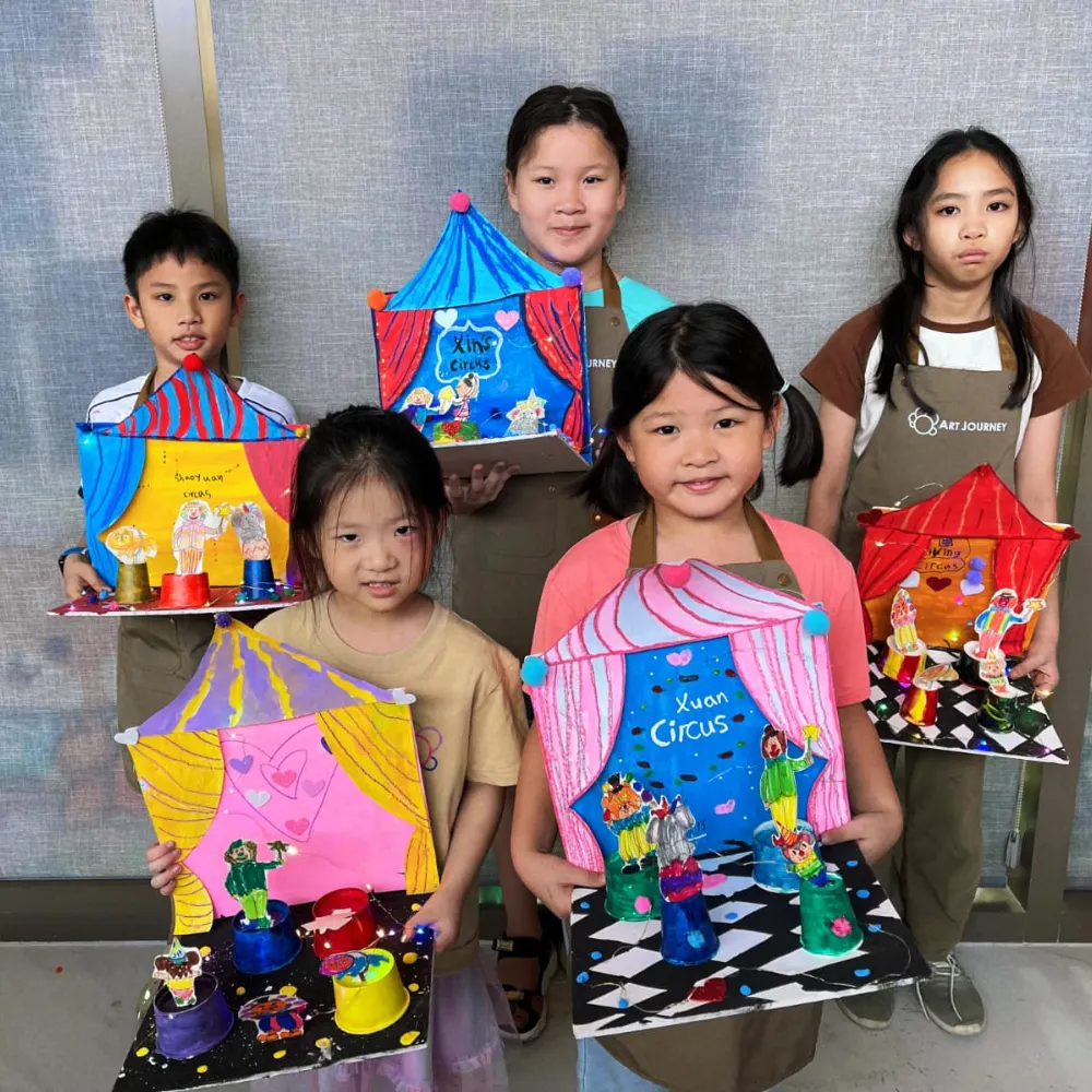 Group of children painting together in a themed art workshop