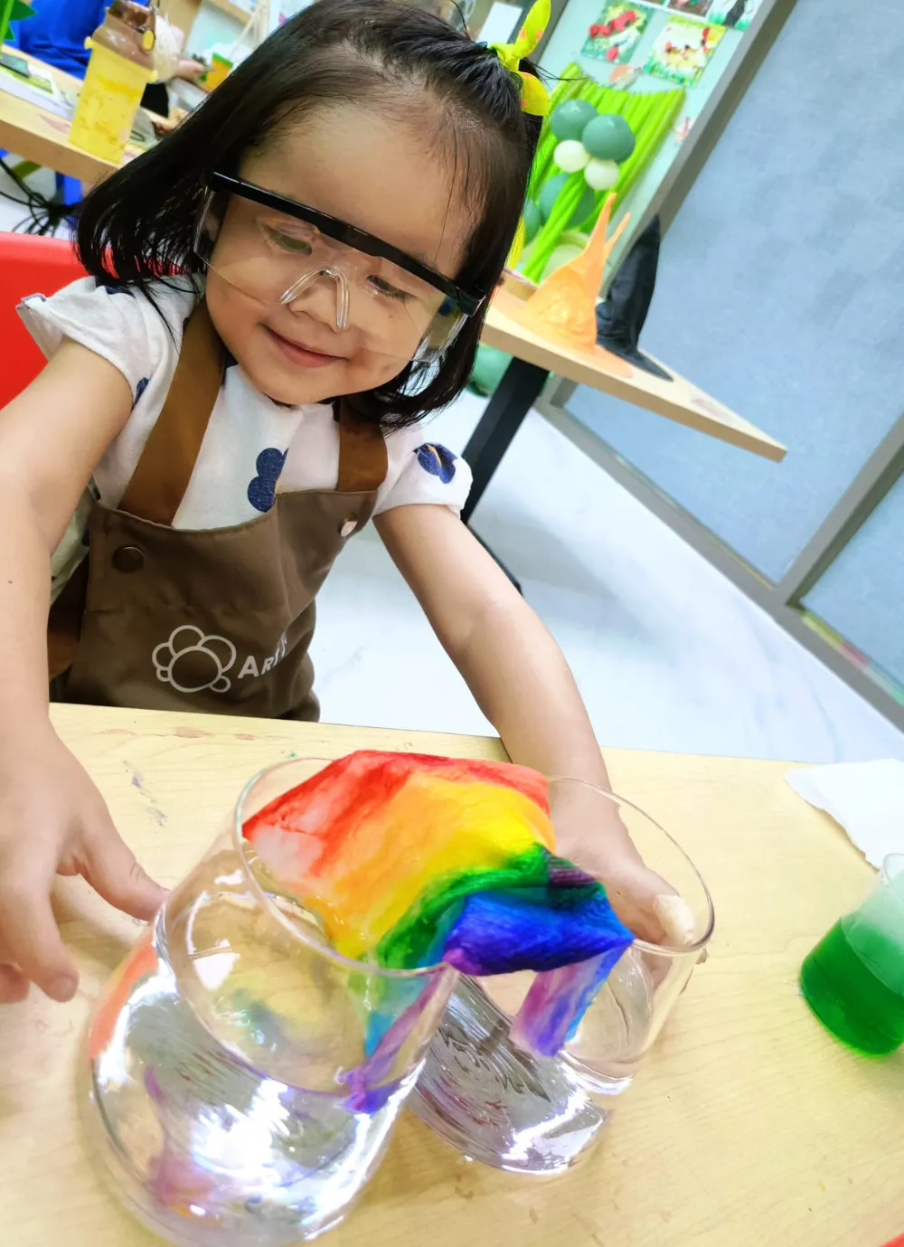 Children smiling and having fun during themed art workshop