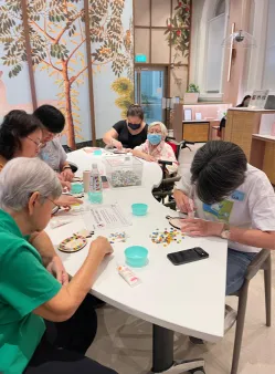 Elderly participants having fun with creative art activities in Singapore