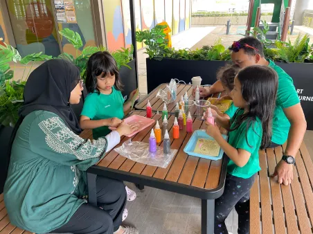 Family enjoying fun art activities together in Singapore