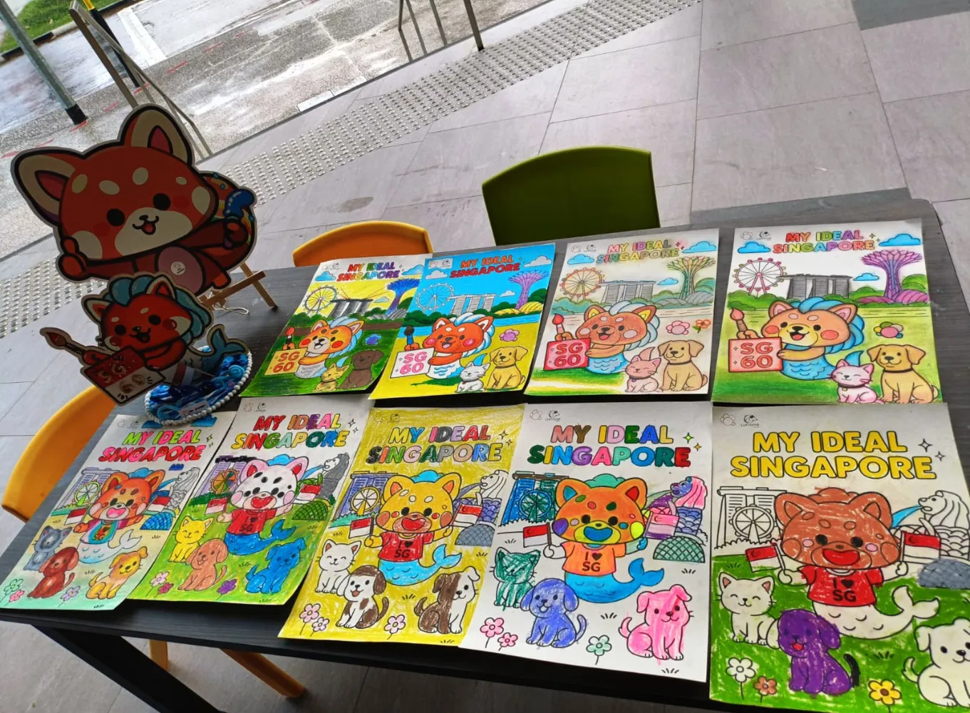 Kids proudly showcasing their artwork during exhibition