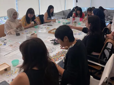 Office team participating in art bonding activity