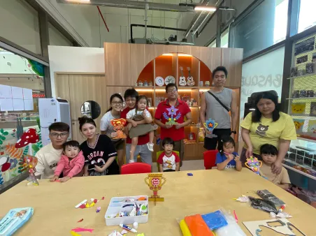Parents and kids painting side by side during bonding workshop
