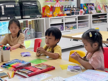 Students participating in creative art competition at school event
