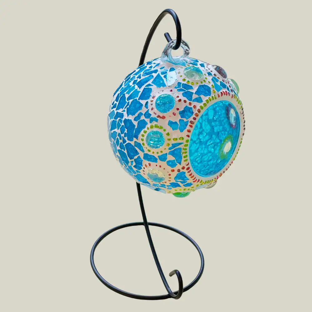 Mosaic candle holder designed for hanging and home decoration.