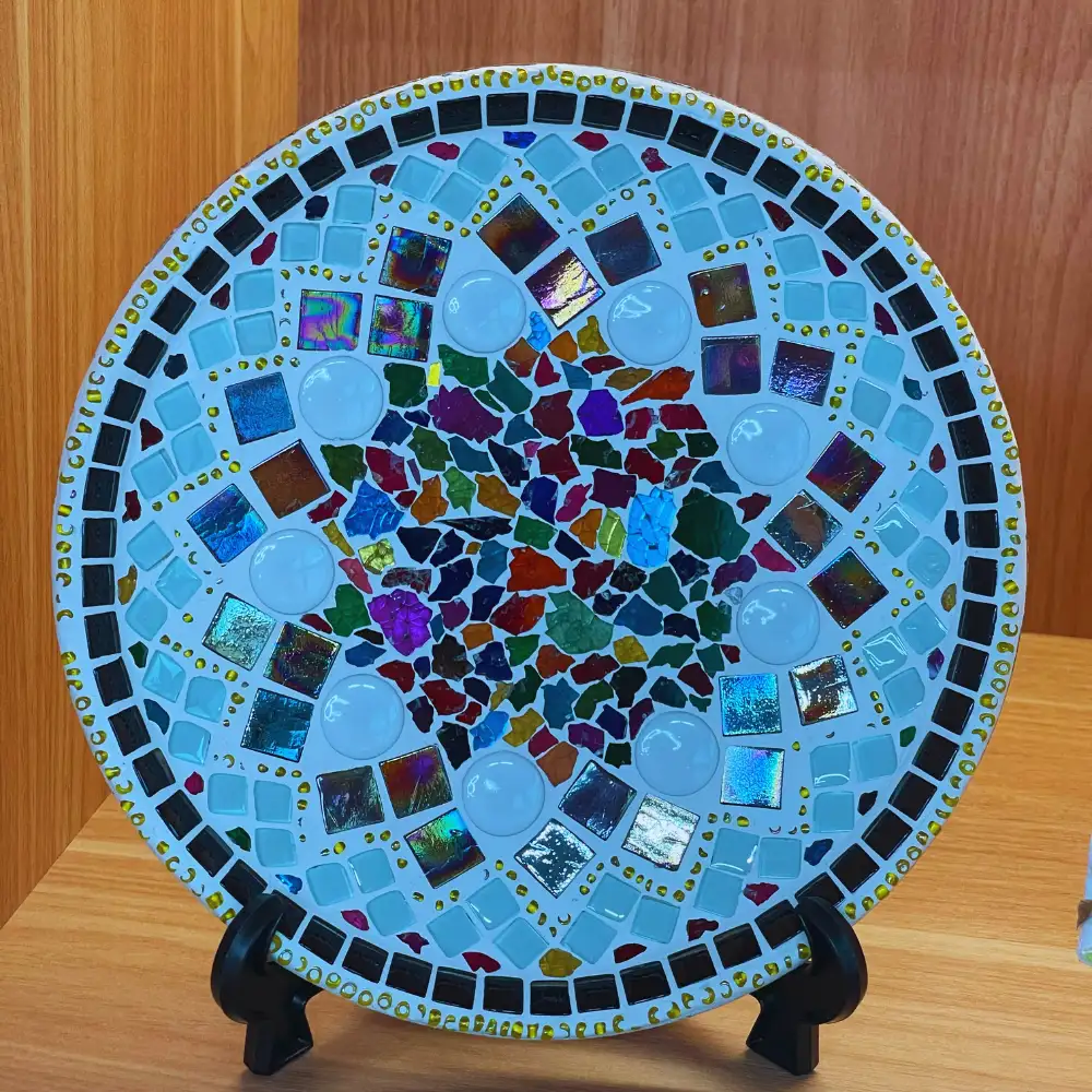 Decorative mosaic plate with vibrant design for interiors.