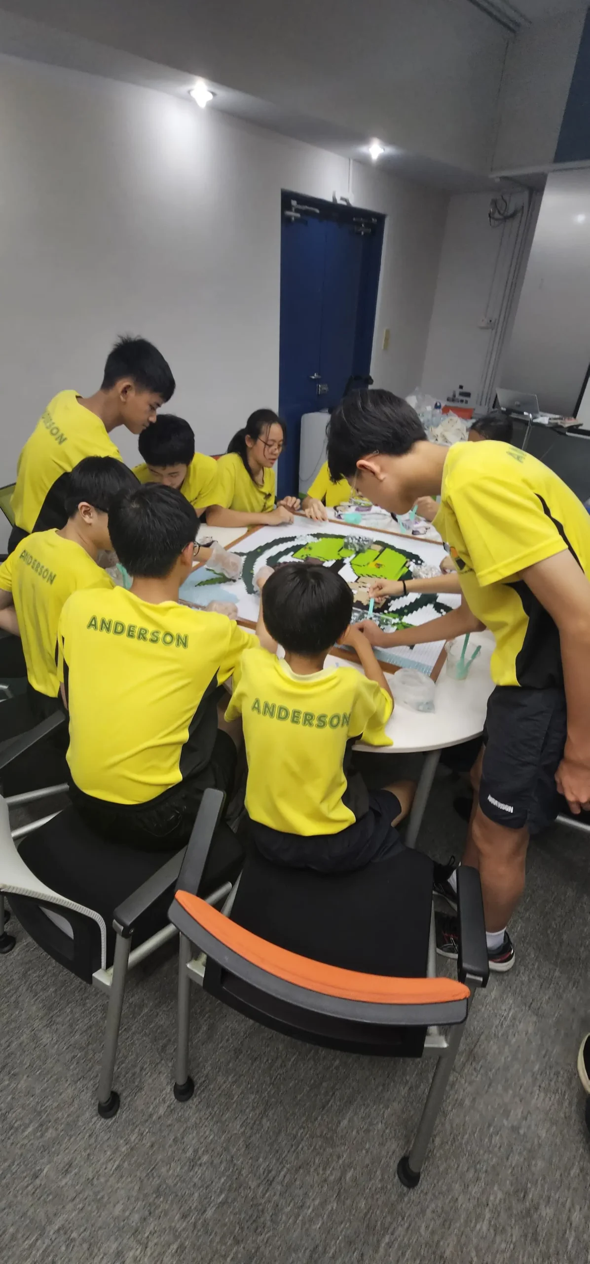 Primary school child working with clay or mosaic materials during a creative workshop at Art Journey Singapore