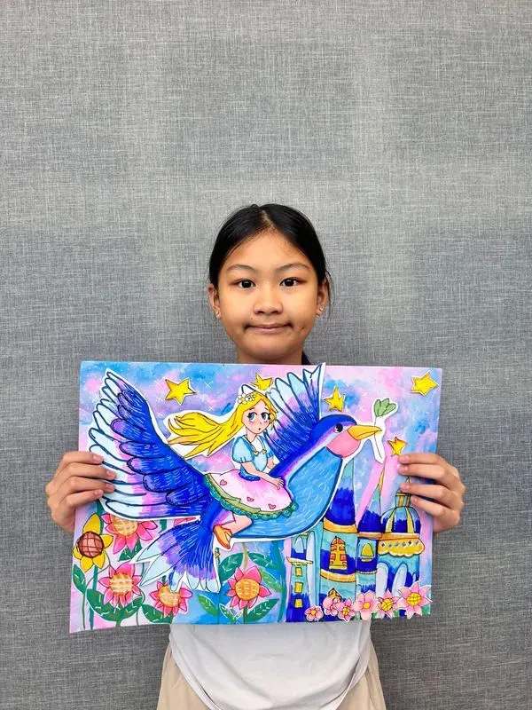 Child holding a detailed fantasy painting of a princess riding a magical blue bird, created at Art Journey Singapore workshop