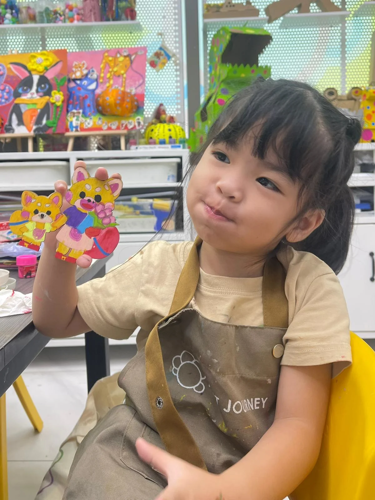 Children celebrating creativity during a Youth Day art workshop at Art Journey Singapore
