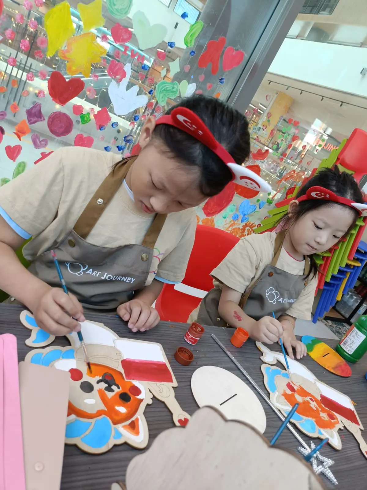 Children creating National Day themed art and crafts at Art Journey Singapore