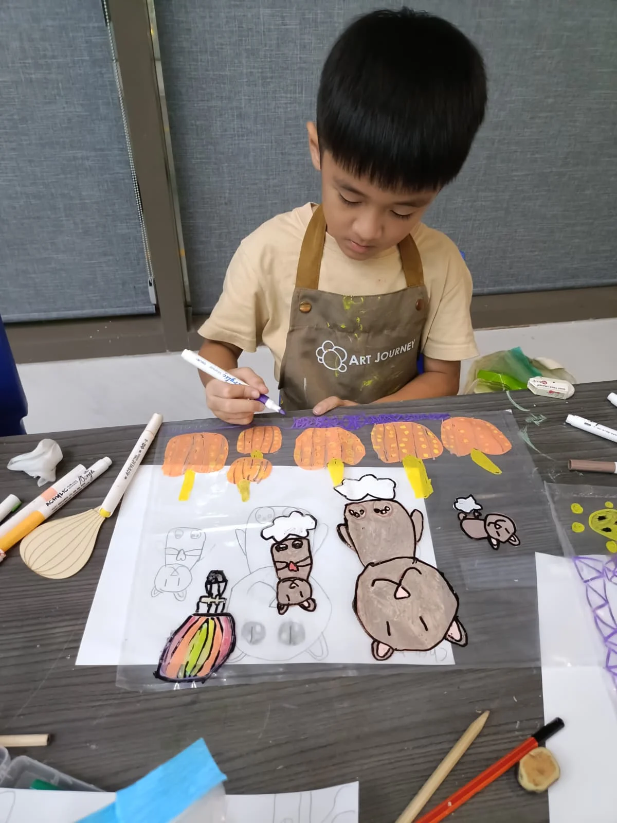 Children creating art with simple materials during a creative session at Art Journey Singapore