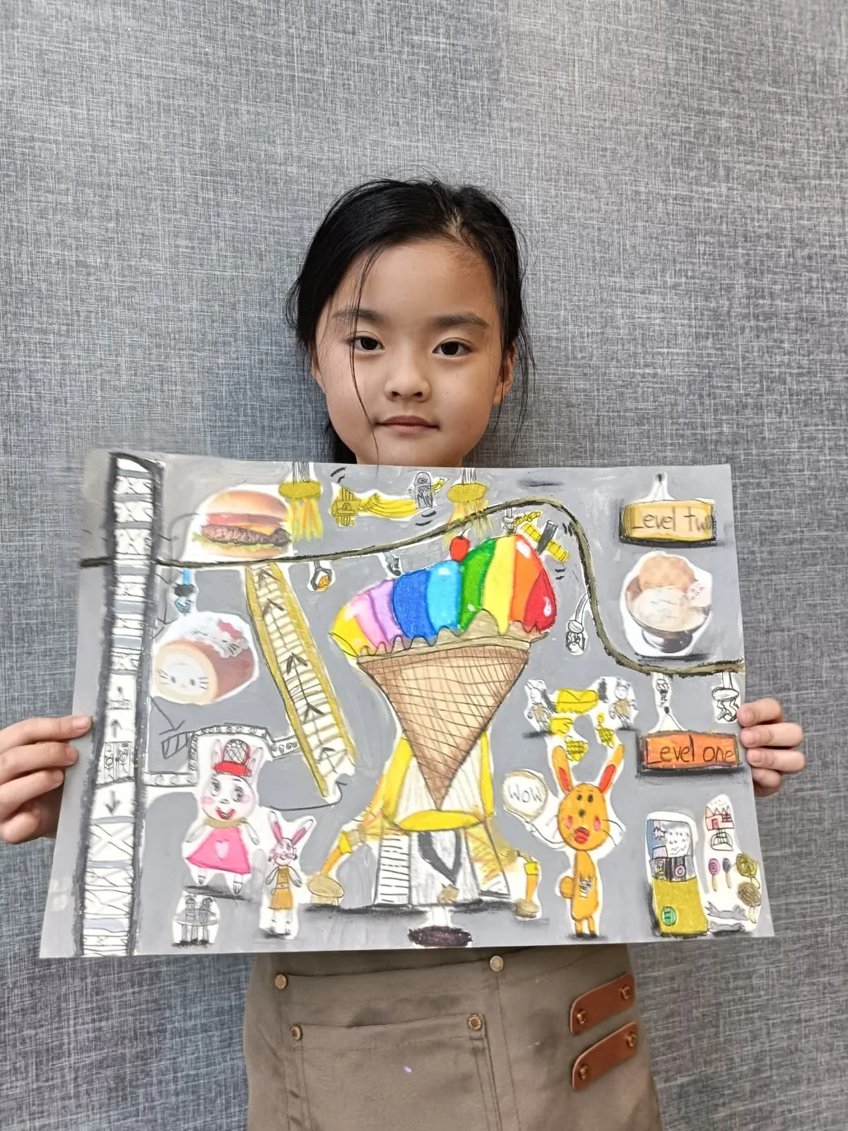 Children showing their unique artwork at Art Journey Singapore — each piece looks different because every child interpreted the theme differently
