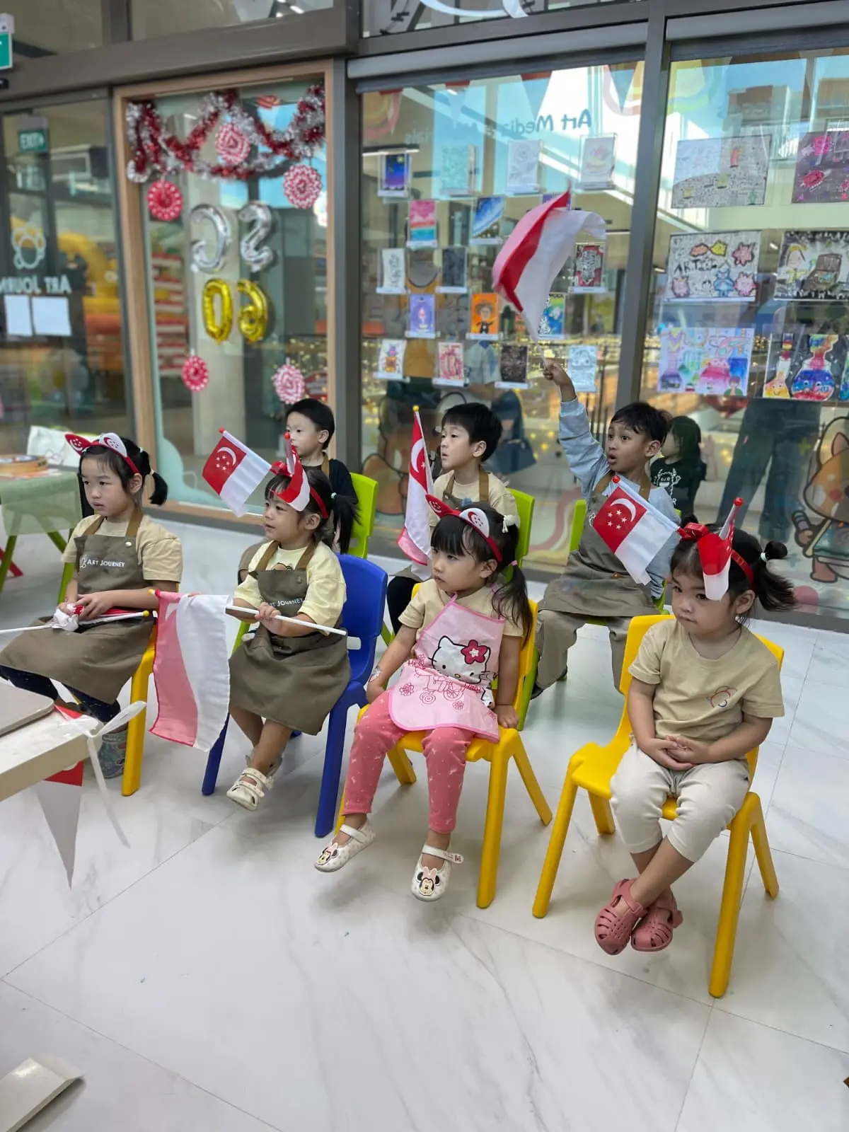 Family enjoying National Day celebrations together in Singapore with children participating in activities