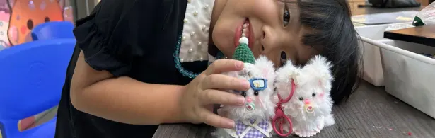 Preschooler following a twist and turn craft project