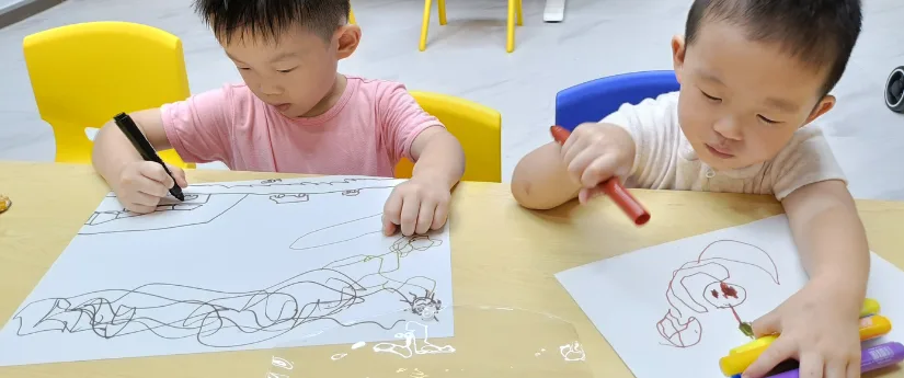 Primary school child painting on canvas at Art Journey Singapore in Tengah