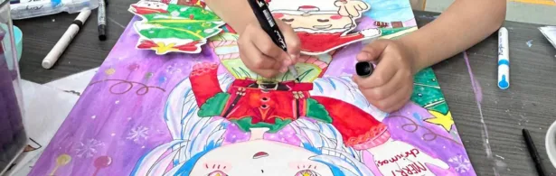 Preschooler hand painting on canvas