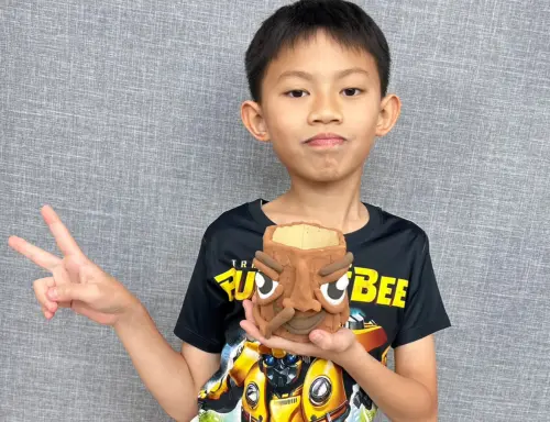 Child working with clay at Art Journey Singapore kids workshop
