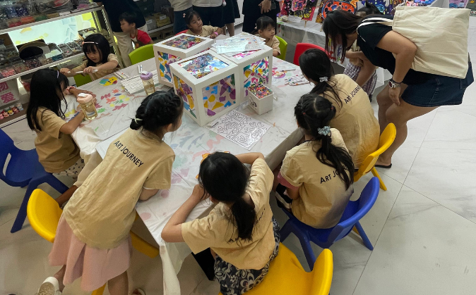 Preschooler painting at Art Journey Singapore in Tengah