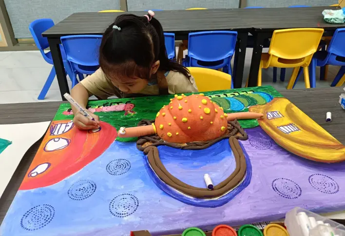 Child painting at Art Journey Singapore — kids art workshop popular with Boon Lay families