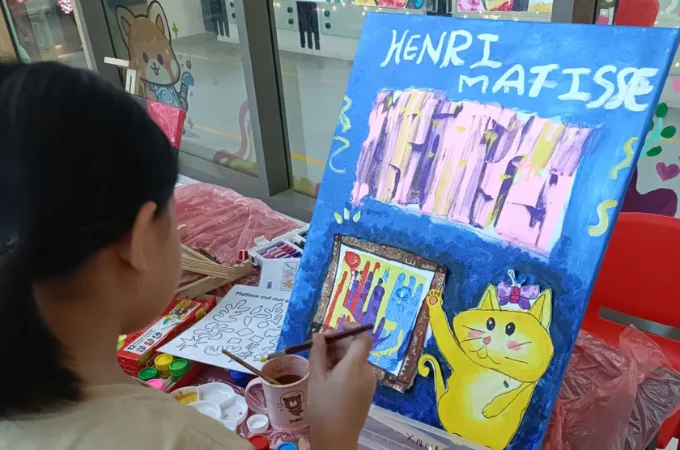 Child painting at Art Journey Singapore — kids art workshop popular with Clementi families