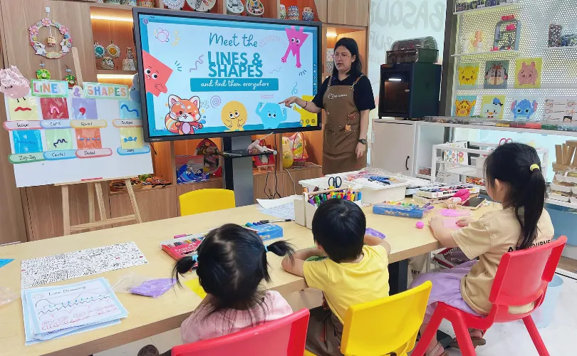 Child working on a carefully guided art project at Art Journey Singapore — popular with Bukit Timah families