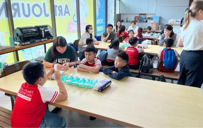 Child working on a story illustration project at Art Journey Singapore September holiday art workshop