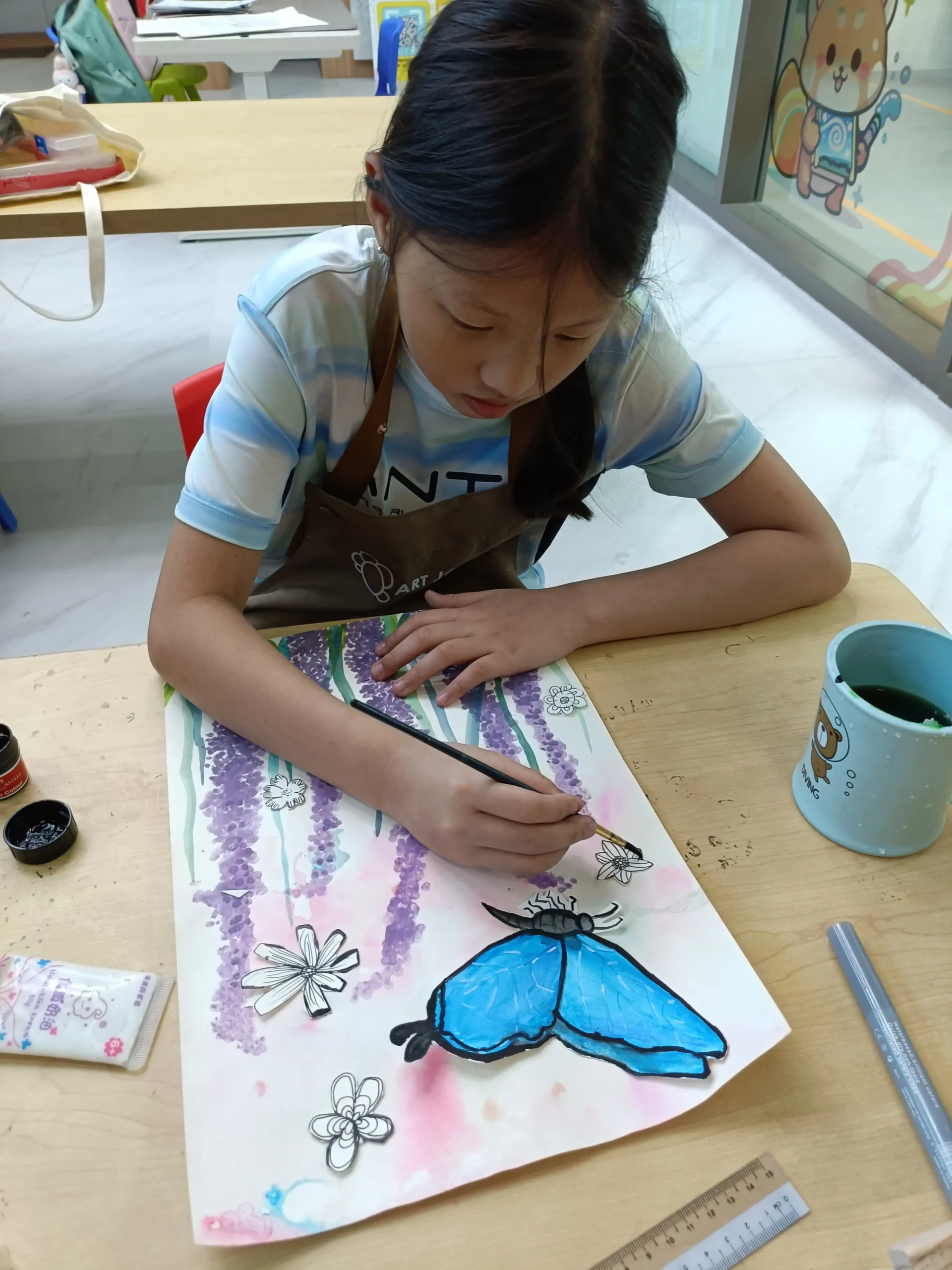 Children engaged in a creative art workshop session at Art Journey Singapore studio