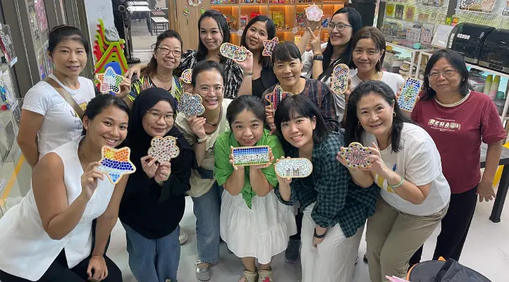 Mums chatting and painting together at Art Journey Singapore studio