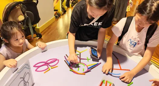 Preschooler playing an educational matching game at Art Journey Singapore