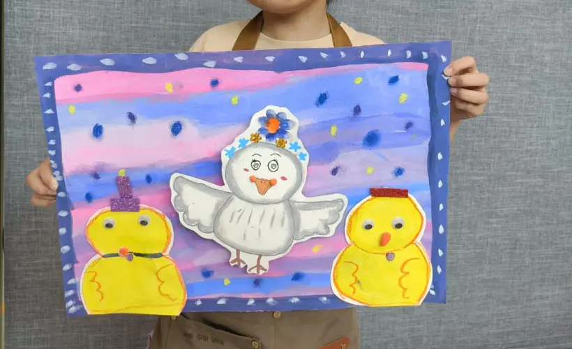 Child displaying completed art portfolio pieces from Art Journey Singapore workshops across different media