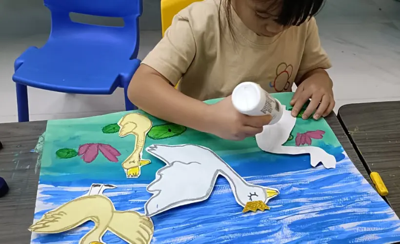 Singapore parent meeting with child's primary school teacher to discuss adding creative enrichment to a busy academic schedule