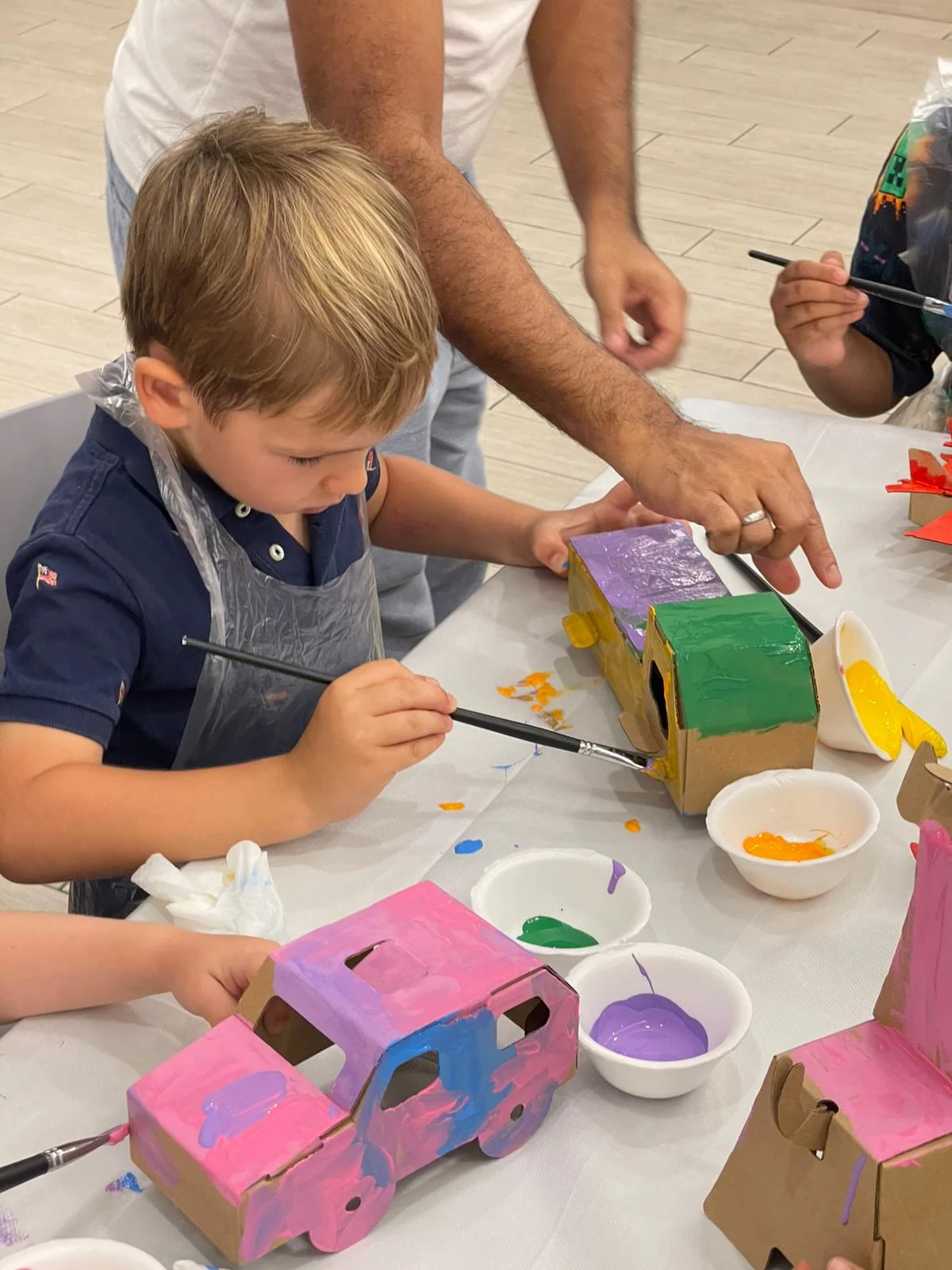 Children working on individual mosaic art projects at a birthday party at Art Journey Singapore